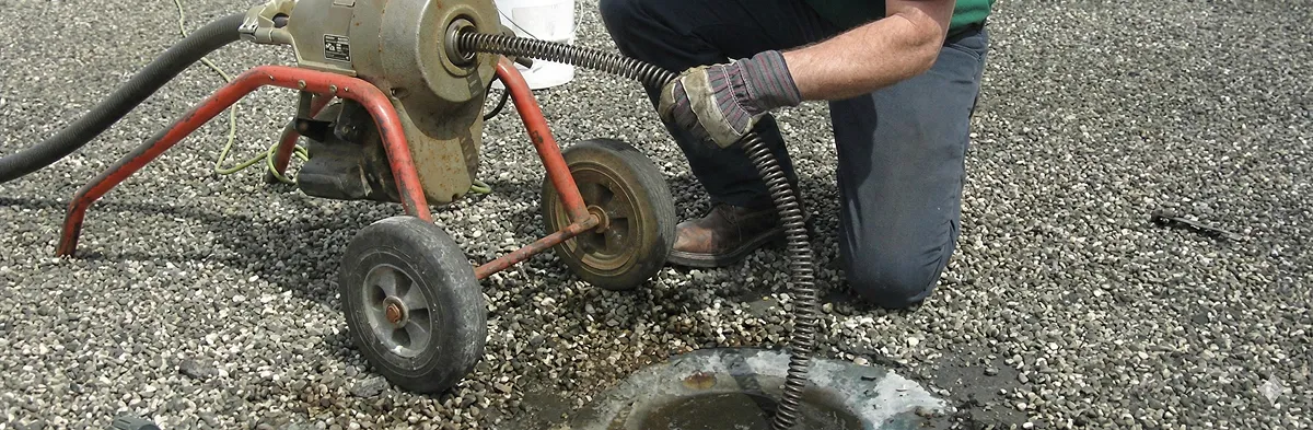 sewer rodding technician actively removing blockages from a sewer line in Indianapolis, IN